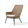 Woven outdoor lounge chair with metal legs and plush cushion in beige